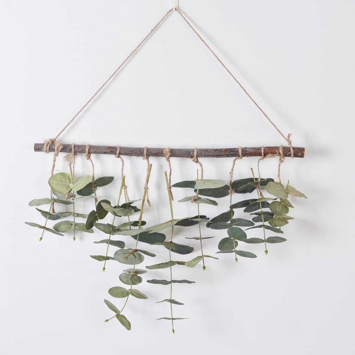 Suspension murale eucalyptus artificiel sur branche